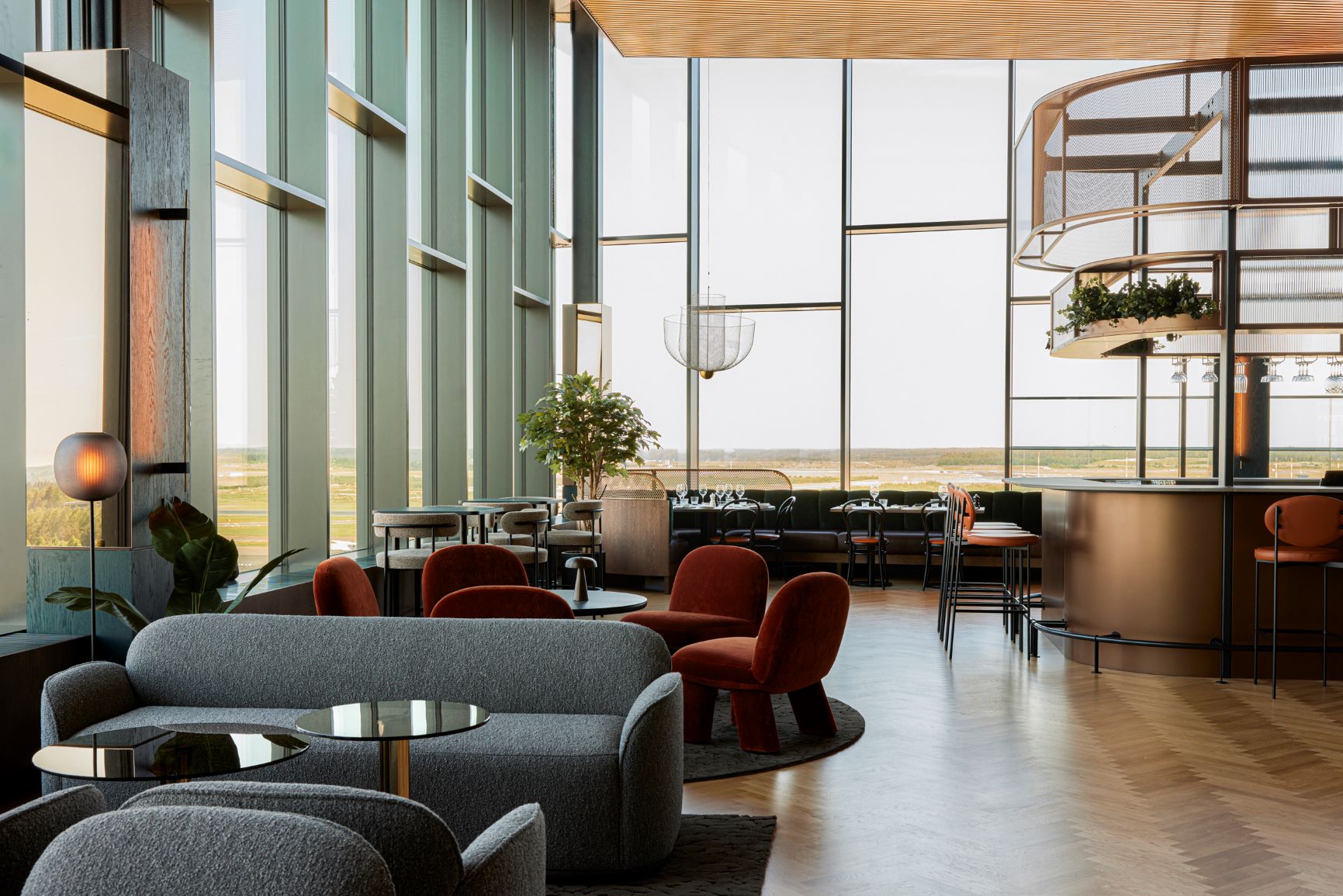 Rooftop bar offering panoramic views of the airport tarmac at Clarion Hotel Helsinki Airport.