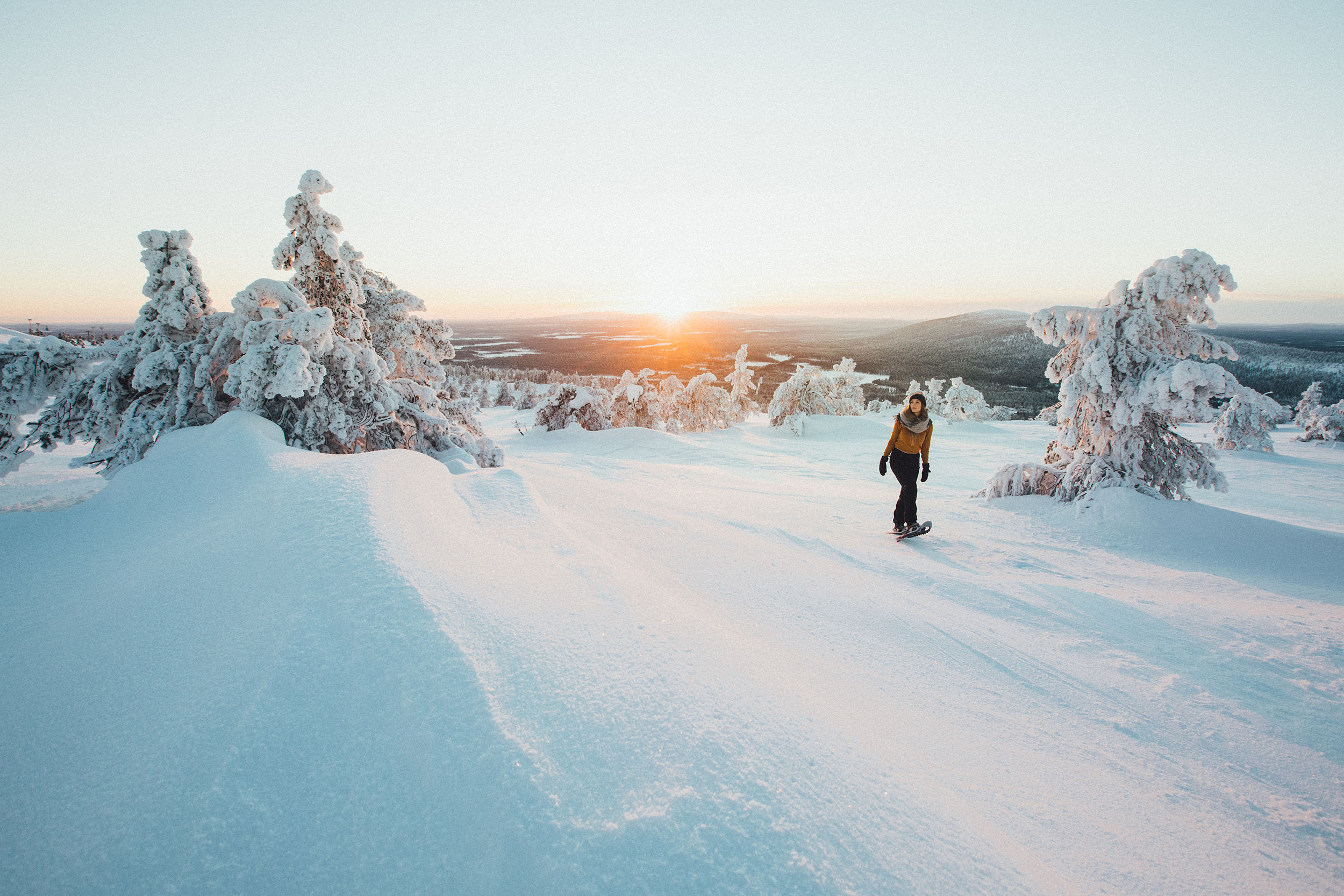 Woman snowshoeing in winter in Finland